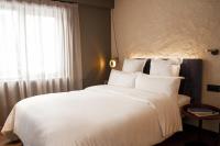 A bed or beds in a room at Letoh Letoh Gran Vía