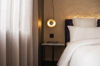 A bed or beds in a room at Letoh Letoh Gran Vía
