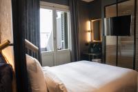 A bed or beds in a room at Letoh Letoh Gran Vía