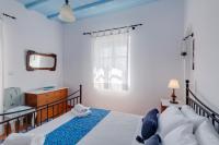 Postel nebo postele na pokoji v ubytování Cycladic Aura - Traditional Holiday Cottage