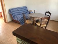 A seating area at Conil Colorado 1 rústico y económico