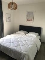 Łóżko lub łóżka w pokoju w obiekcie Maison 8 personnes Biscarrosse bourg