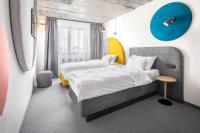 Postel nebo postele na pokoji v ubytování Boutique Hotel Mezi švy
