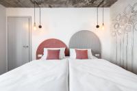 Postel nebo postele na pokoji v ubytování Boutique Hotel Mezi švy