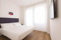 Posteľ alebo postele v izbe v ubytovaní Fiorentini Residence MILANO
