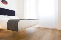 Posteľ alebo postele v izbe v ubytovaní Fiorentini Residence MILANO