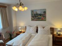 Łóżko lub łóżka w pokoju w obiekcie Apartment Ploner