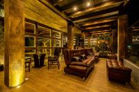 a living room with a couch and chairs and a table at Orgánico Hotel Boutique in Mexico City