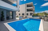 Bazén v ubytování Family-friendly apartments with swimming pools Vantacici, Krk - 19303 nebo v jeho okolí
