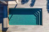 a swimming pool in a house with water in it at Villa avec piscine privée à Sainte Lucie in Sainte-Lucie de Porto-Vecchio