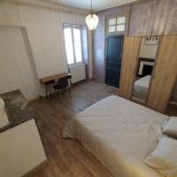 a bedroom with a bed and a desk and a table at Halles Brauhauban Tarbes - T6 en collocation - Louez votre chambre in Tarbes