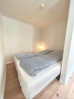 Postel nebo postele na pokoji v ubytování Rebslagerhuset