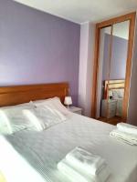 Postel nebo postele na pokoji v ubytování La Magdalena, acogedor apartamento en Villaviciosa