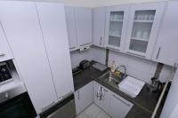 Kuchyňa alebo kuchynka v ubytovaní Kinder Apartman