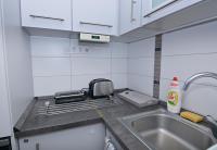 Kuchyňa alebo kuchynka v ubytovaní Kinder Apartman