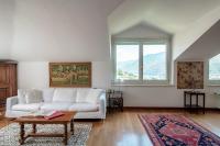 A seating area at I D'A Charming Penthouse - LAKE VIEW- Como- House-130 mt-2 double bedrooms and 2 double bathrooms a spacious living room-Full equipped kitchen-Private garden and terrace-Private covered parking