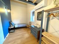 a bedroom with a bed and a dresser in a room at Meublé de tourisme 4 étoiles Logis Riquet proche de Carcassonne in Caux-et-Sauzens