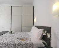 Posteľ alebo postele v izbe v ubytovaní Pasubio Apartment