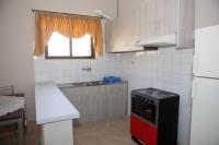 A kitchen or kitchenette at Vasileiou Apartments
