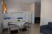 A kitchen or kitchenette at Vasileiou Apartments