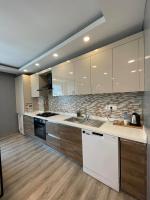 A kitchen or kitchenette at On4 Rooms & Suites