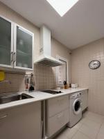 Kuchyň nebo kuchyňský kout v ubytování Apartamento en la playa de Valdelagrana