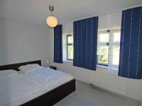 Postel nebo postele na pokoji v ubytování Fischerhaus Baabe - WG 01 mit Terrasse, natur- und strandnah