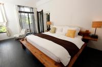 a bedroom with a large bed and a window at Mudanwan Villa in Mudan