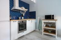 Kuchyň nebo kuchyňský kout v ubytování Le Méditarranéen de COUP DE COEUR APPARTEMENTS