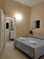 Posteľ alebo postele v izbe v ubytovaní La Liama di CasAda