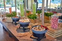 a buffet of food on a table in a restaurant at PARKROYAL COLLECTION Marina Bay, Singapore in Singapore
