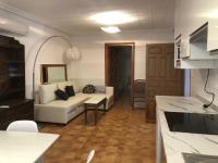 Televízia a/alebo spoločenská miestnosť v ubytovaní Apartamentos Toledo Casa Galería de los Aljibes