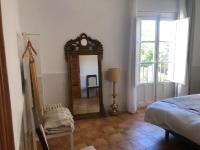 Posteľ alebo postele v izbe v ubytovaní Apartamentos Toledo Casa Galería de los Aljibes