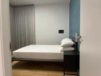 Łóżko lub łóżka w pokoju w obiekcie Adriatico Luxury Apartments