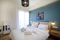 Posteľ alebo postele v izbe v ubytovaní Eos Residence
