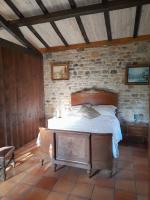 Posteľ alebo postele v izbe v ubytovaní La petite maison bleue avec piscine