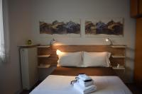 A bed or beds in a room at happy2 Dafni Family home near Athens, airport, ports
