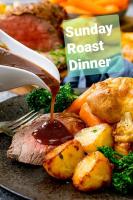 a plate of food with meat and vegetables with gravy at Palm garden paradise in Pervolia