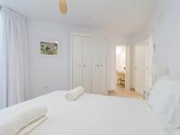 A bed or beds in a room at Pasitoblanco Porto Mare 7 Seaview Villa private heated pool