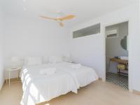 A bed or beds in a room at Pasitoblanco Porto Mare 7 Seaview Villa private heated pool