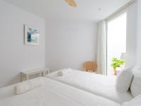 A bed or beds in a room at Pasitoblanco Porto Mare 7 Seaview Villa private heated pool