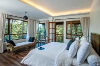 Tira Vilagna Suites & Spaにあるベッド
