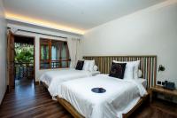 Tira Vilagna Suites & Spaにあるベッド
