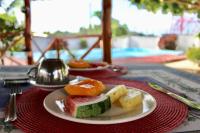 a plate of food sitting on top of a table at Villa Francesca Boutique Hotel in Uroa