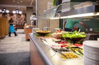 a buffet line with many different types of food at Hôtel Club mmv Le Flaine *** in Flaine