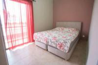 A bed or beds in a room at Vasileiou Apartments