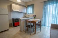A kitchen or kitchenette at Vasileiou Apartments