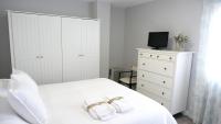 A bed or beds in a room at Slappe Jaén I