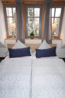 Postel nebo postele na pokoji v ubytování BluGarden Ferienapartments im Spreewald