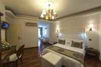 A bed or beds in a room at Hotel Palma